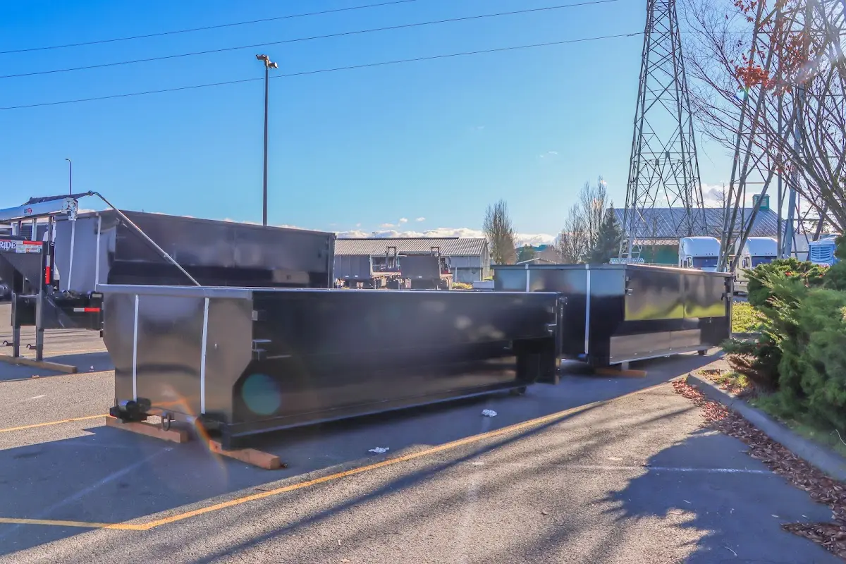 Roll-off dumpster ready for waste disposal at job site for Yard Waste Dumpster Rental in Wilson